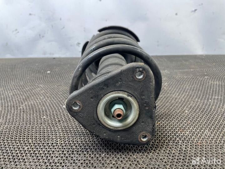 Передний левый амортизатор Mazda 3 Bl