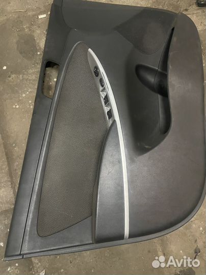 Обшивка двери передняя левая solaris 1