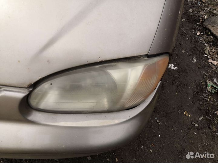 Передняя левая фара KIA Sephia