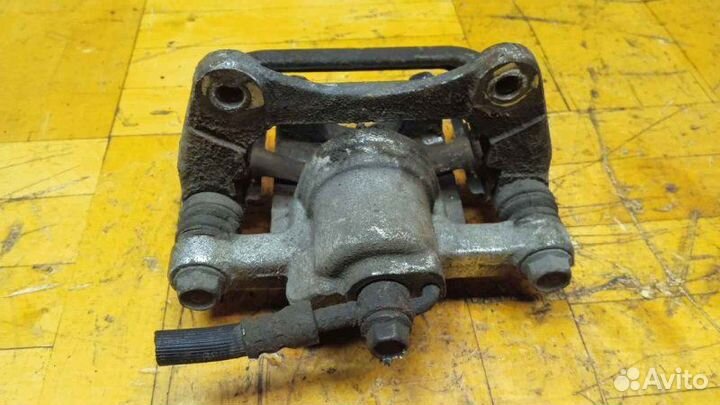 Суппорт задний левый Chevrolet Lacetti