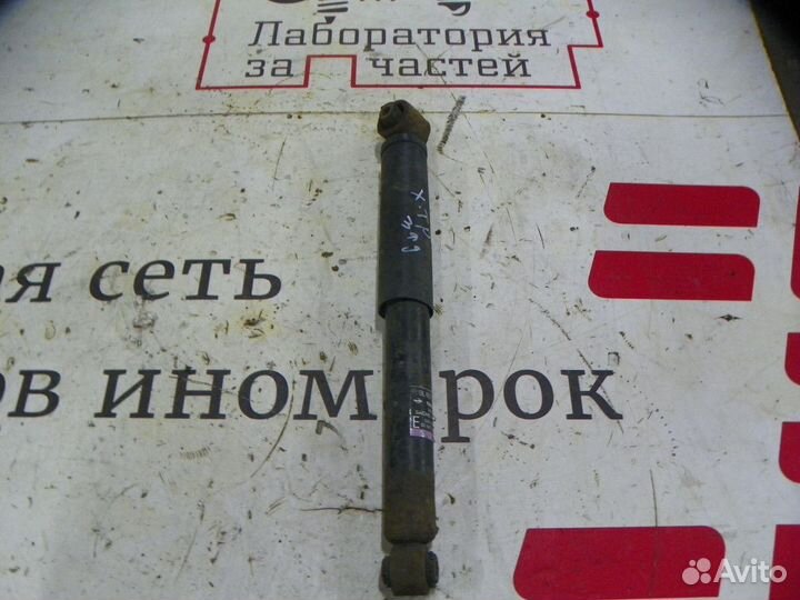 Амортизатор задний Nissan X-Trail II (2007—2011)