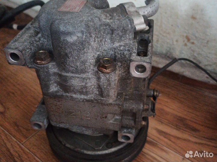 Компрессор кондиционера Мазда familia