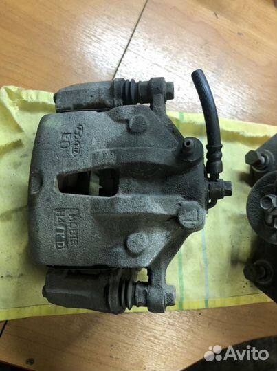 Суппорт передний левый Kia Cerato 2