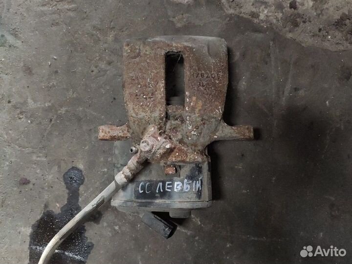 Суппорт задний левый Фольксваген Пассат сс