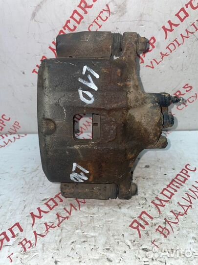 Суппорт тормозной передний левый Mitsubishi Lancer