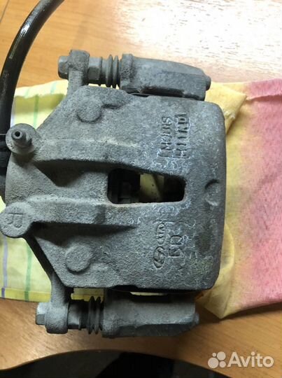 Суппорт передний левый Kia Cerato 2