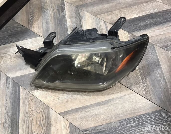 Фара левая Mitsubishi Outlander