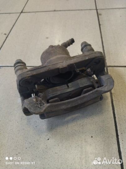 Суппорт тормозной передний правый Kia Picanto 1