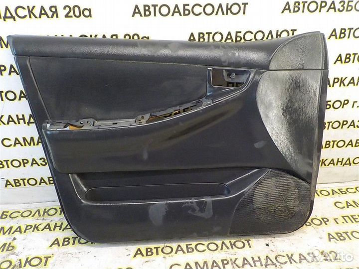 Обшивка двери передней левой Toyota Corolla (E120