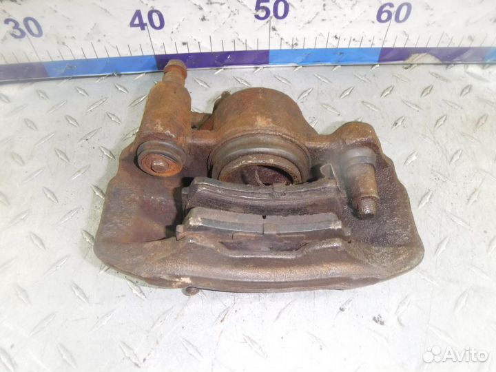 Суппорт тормозной передний левый Kia Rio