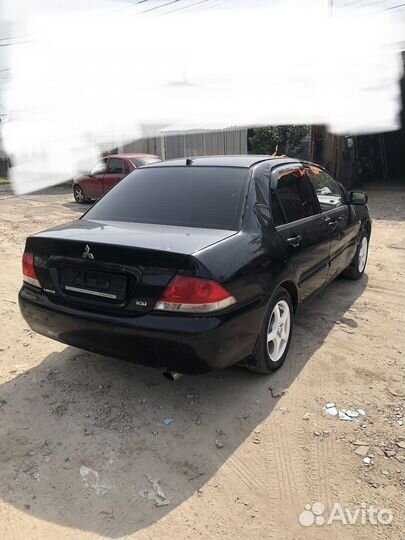 В разборе Mitsubishi Lancer 9 лансер 4g18 1.6