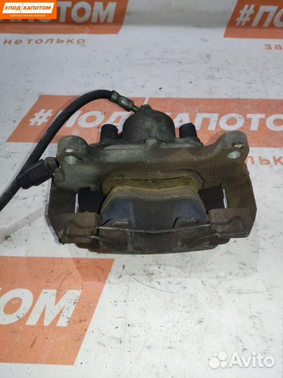 Суппорт тормозной передний левый Volkswagen Caddy