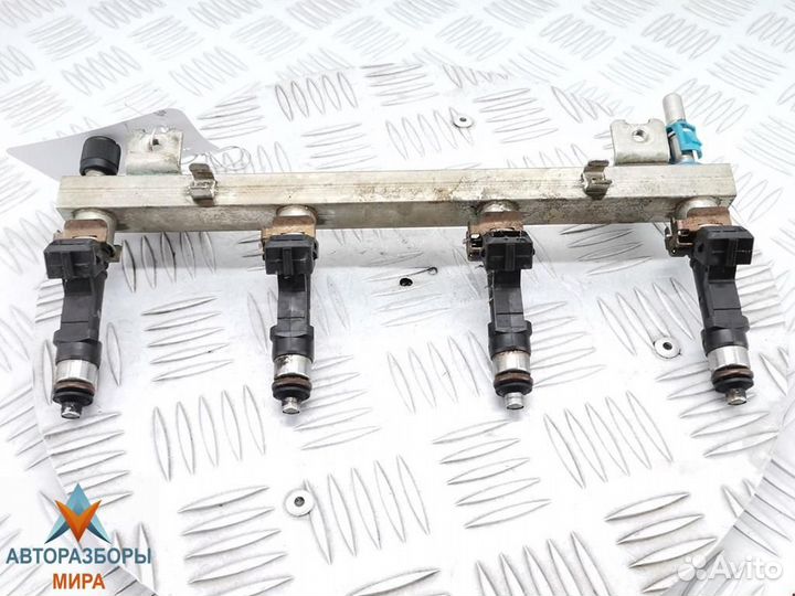 Форсунка Opel Corsa D 2009 55562250