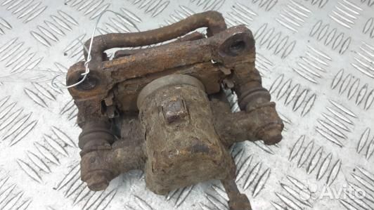 Суппорт тормозной задний левый toyota corolla E12