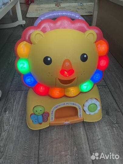 Каталка лев fisher price