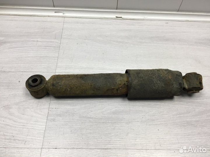 Амортизатор подвески задний левый Nissan