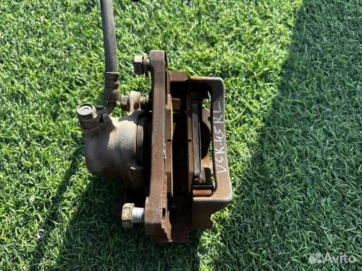 Суппорт тормозной задний левый Toyota Sequoia