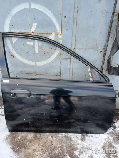 Передняя правая дверь Kia Spectra