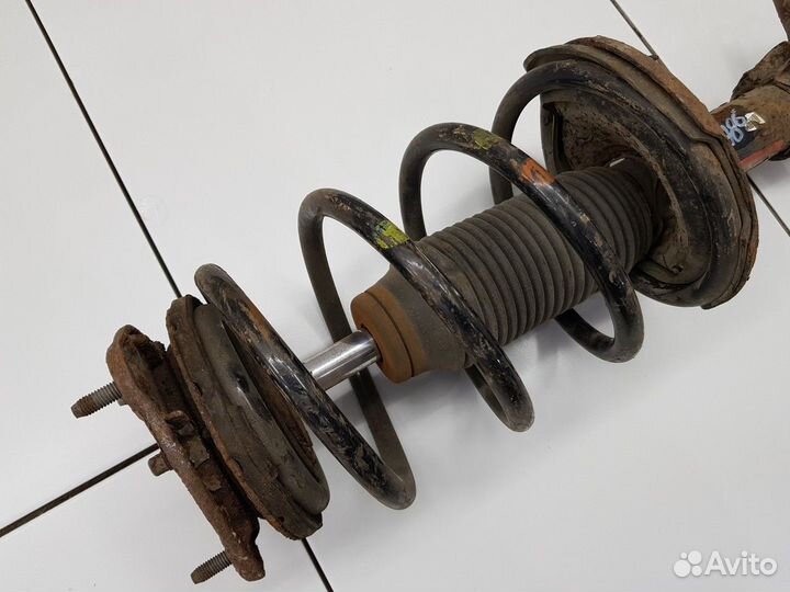 Амортизатор передний левый с пружиной (Kia Rio)