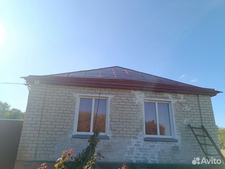 Покраска крыши дома