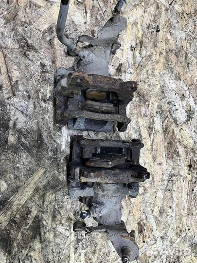 Суппорт задний левый правый Geely ec7 Emgrand