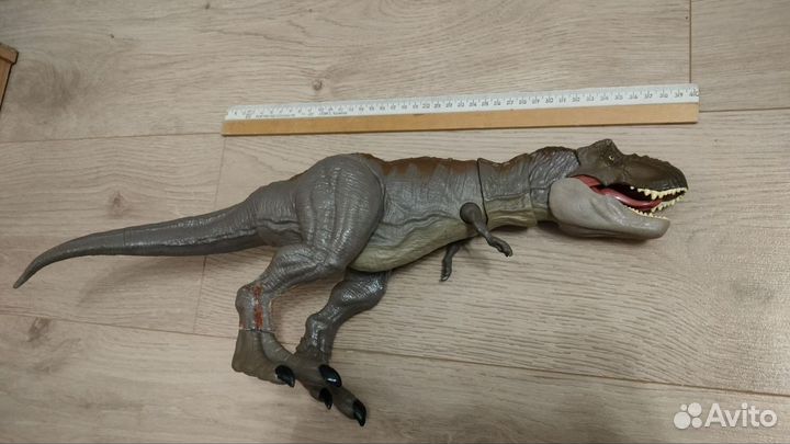 Детская игрушка - динозавр Рекс