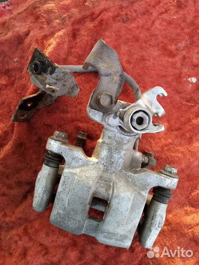 Суппорт задний левый Mazda 6GG