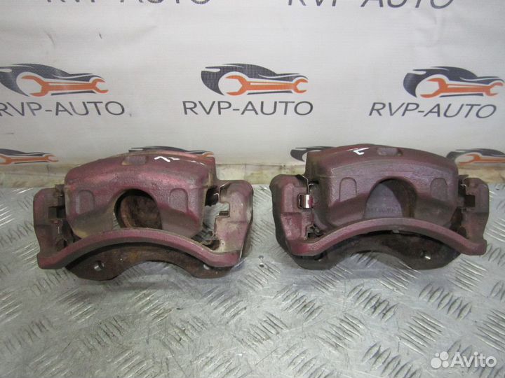 Суппорт тормозной передний Nissan Laurel C35 97-02