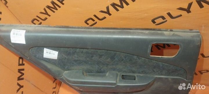 Обшивка двери задняя левая Toyota Carina AT212