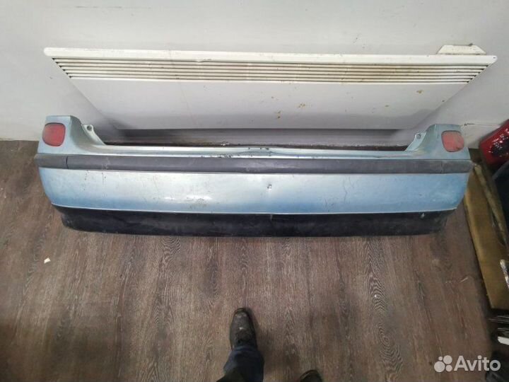 Бампер задний Nissan Tino