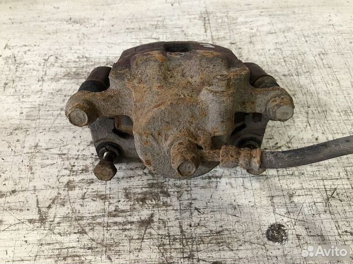 Суппорт передний тормозной Nissan Almera N15