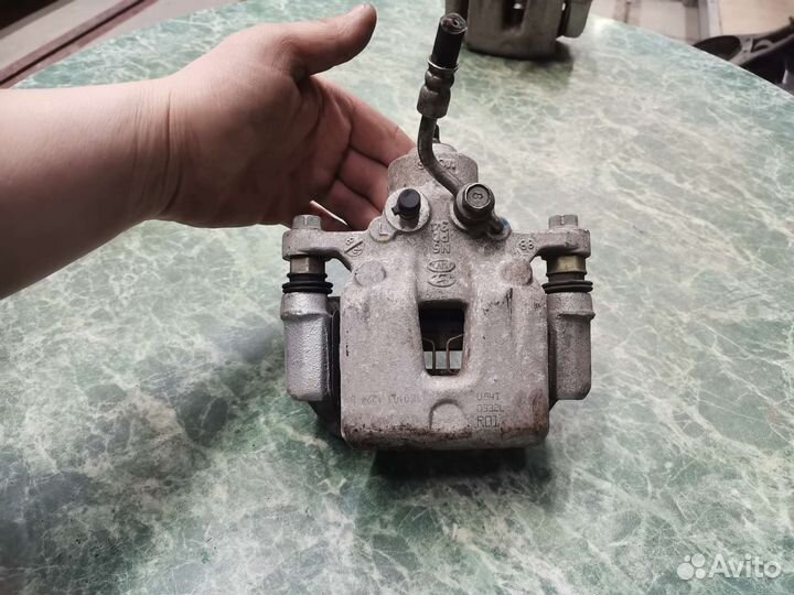 Суппорт задний левый Kia K3