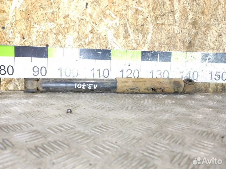 Амортизатор задний левый Mitsubishi L200 2006-2016