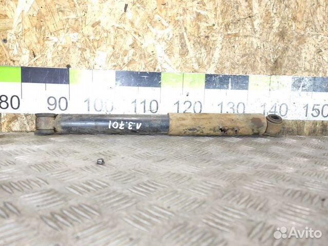 Амортизатор задний левый Mitsubishi L200 2006-2016