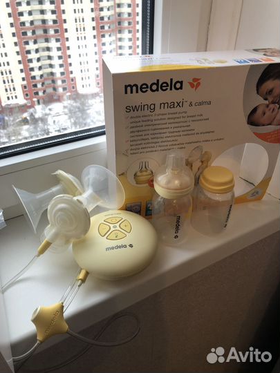 Молокоотсос medela swing maxi
