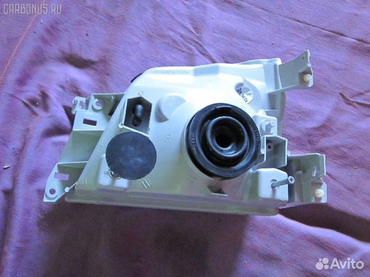 Фара 100-24774 depo 215-11A5-RD-E на Nissan Carava