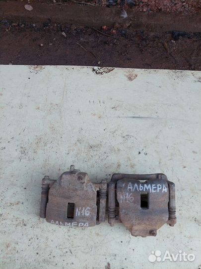 Суппорт левый передний на nissan almera N16