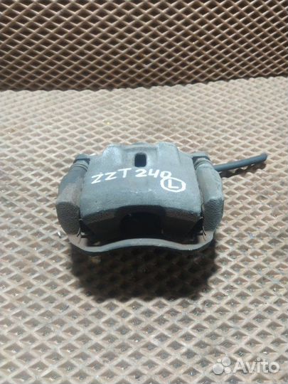 Суппорт тормозной передний левый Toyota Premio