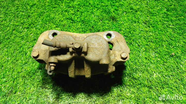 Суппорт тормозной передний левый Hyundai Starex