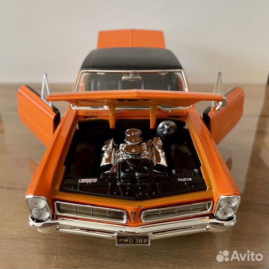 Модель автомобиля Pontiac GTO 1965 1:18 оранжевый