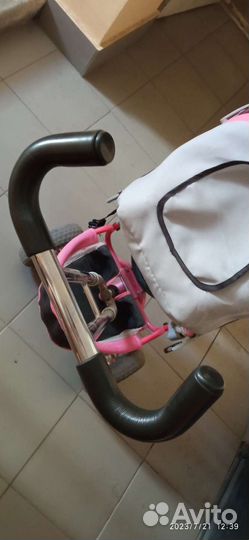 Трехколесный велосипед с ручкой