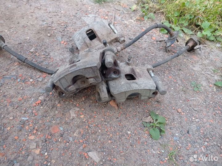 Задние суппорта на митсубиси лансер 10