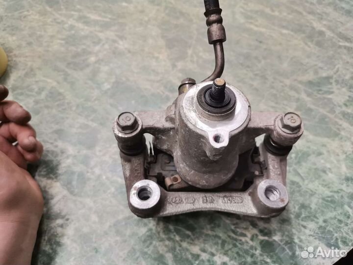 Суппорт задний левый Kia K3