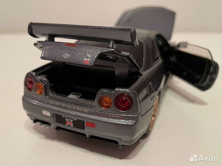 Модель Nissan Skyline R34 GTR масштаб 1:32