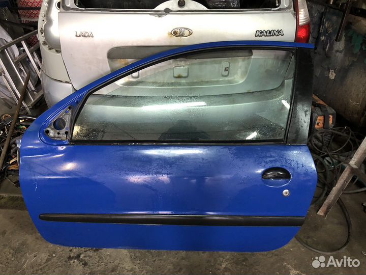 Дверь левая peugeot 206