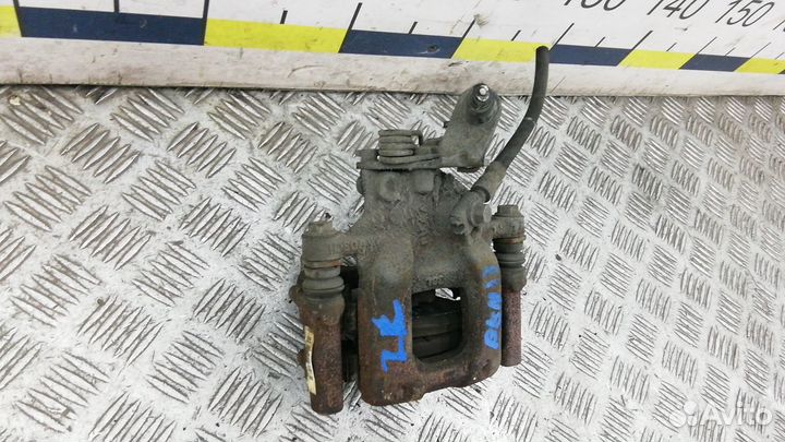 Суппорт тормозной задний левый на Skoda Octavia A5