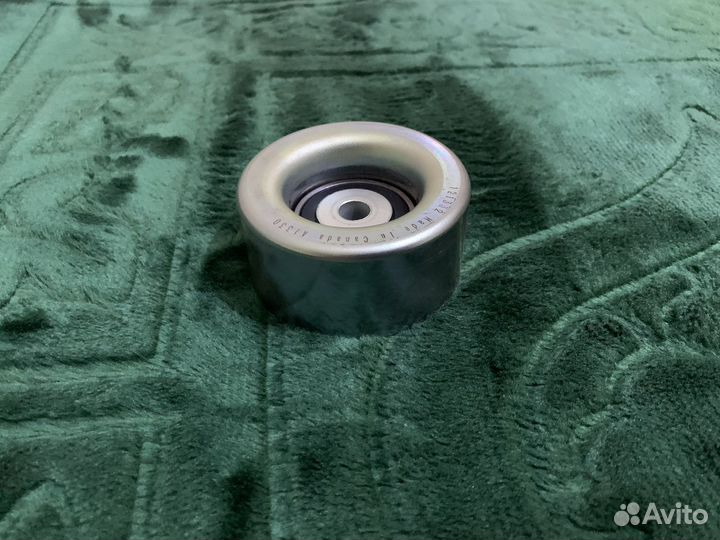 Натяжной ролик