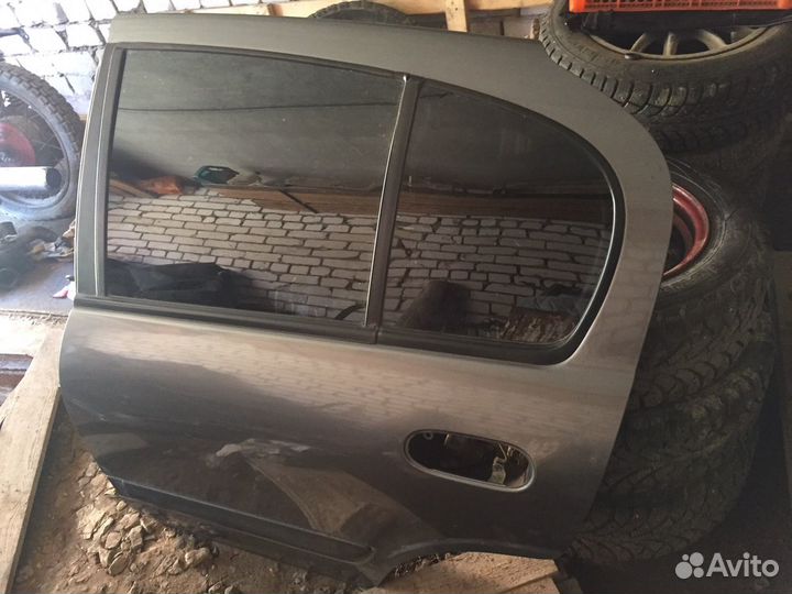 Дверь задняя левая almera n16