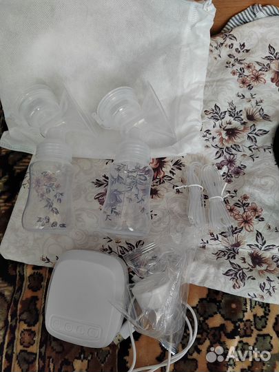 Молокоотсос электрический новый