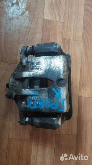 Суппорт тормозной передний правый Kia Sportage 3